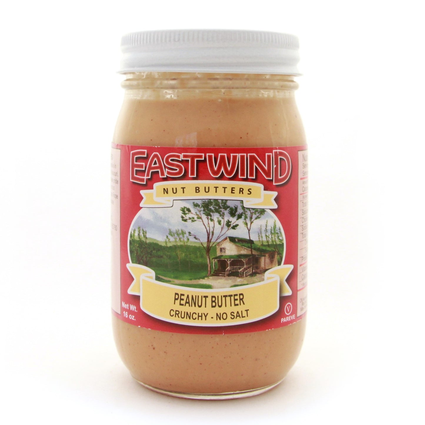 A 16 ounce glass jar of East Wind Nut Butters' Valencia peanut butter, crunchy with no salt.