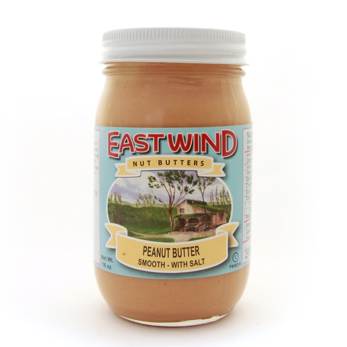A 16 ounce glass jar of East Wind Nut Butters' Valencia peanut butter, smooth with salt.